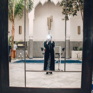 Girl taking a picture in the mirror