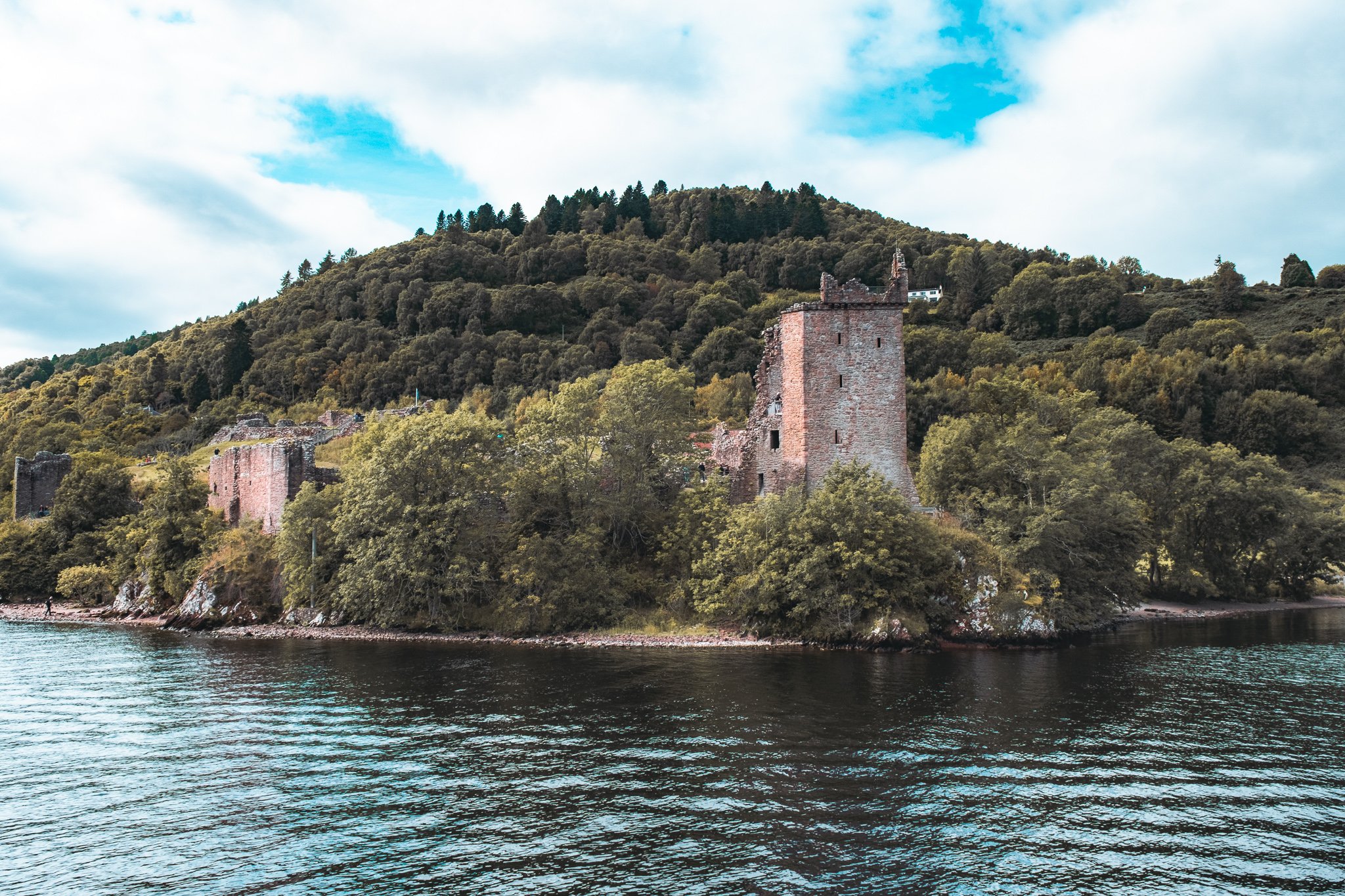 Urquhart Castle surrounded by Loch Ness